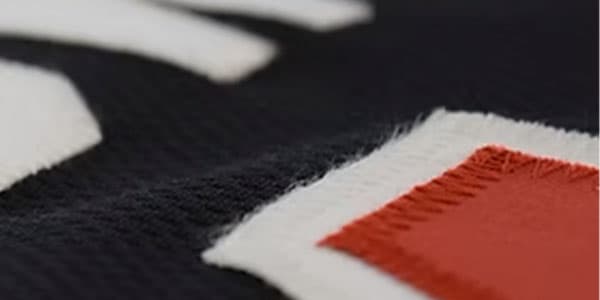 Tackle twill stitched lettering and numbers